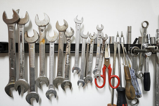Close-up of work tools on magnet at workshop