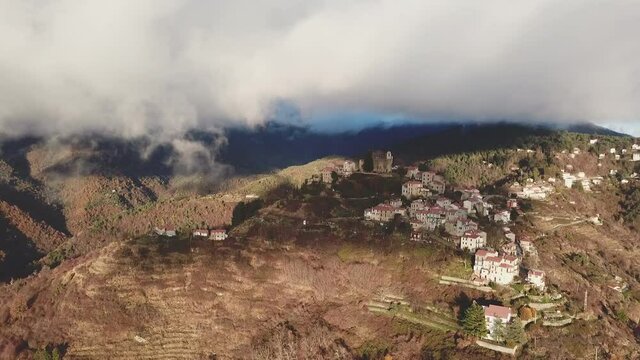 Bajardo village town in mountain countryside aerial view. Baiardo landscape in Liguria Italy.