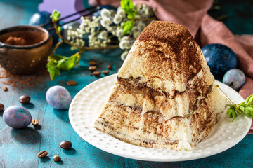 Easter background. Dessert tiramisu Easter cottage cheese  pascha on festive table.