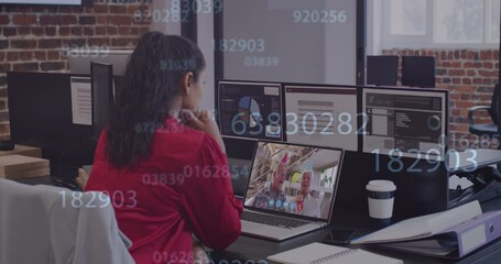 Animation of numbers changing over woman using laptop on video call - Powered by Adobe