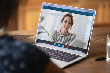Close up businesswoman making video call, discussing project with colleague online, using laptop and webcam, student watching webinar or training, manager involved in conference, consulting client