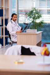 Young male doctor radiologist working in the clinic