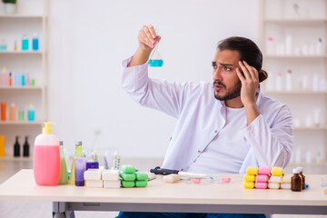 Young male chemist testing soap in the lab