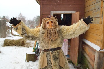 People in demon masks are preparing for caroling in Russia.