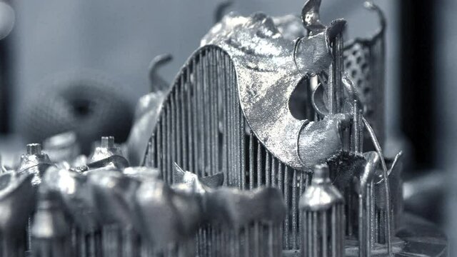 3D model of human teeth printed on metal 3d printer close-up. Technology selective laser melting, sintering metal. New prototyping additive technology. Medical stomatological dental crowns bridge