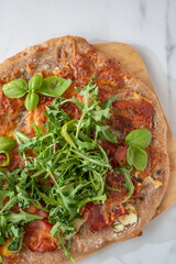 healthy green whole grain pizza with vegetables