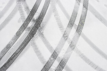 Car tracks in the snow.