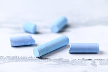 Soft pastels on bright wooden background. Close up.