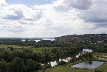 Top view of the forest, field, river and hill