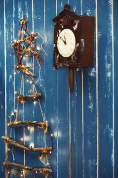 Christmas decorations hanging on blue wooden wall