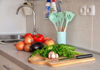 Various fruits and vegetables on kitchen desk