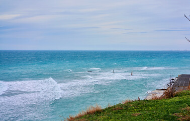 man goes windsurfing on the sea