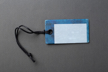Clothing tag, label blank mockup template on a paper background. Price tag, gift tag
