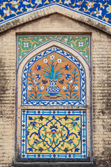 Beautiful colorful kashi-kari or faience tile mosaic design on ancient mughal era Wazir Khan mosque in the walled city of Lahore, Punjab, Pakistan
