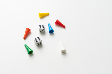 Game cubes, chips, hourglass on a white background. The concept of home Board games, classes at home with children, developmental training, logic games. Flatlay and space for text.