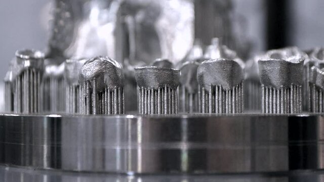 3D model of human teeth printed on metal 3d printer close-up. Technology selective laser melting, sintering metal. New prototyping additive technology. Medical stomatological dental crowns bridge