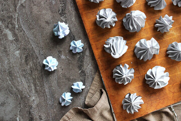 Grey meringues on a marble table