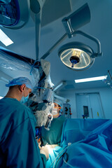In surgery. Medical team performing operation in hospital operating theater. Working with surgical instruments.