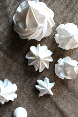 White meringues on a linen towel