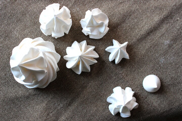 White meringues on a linen towel