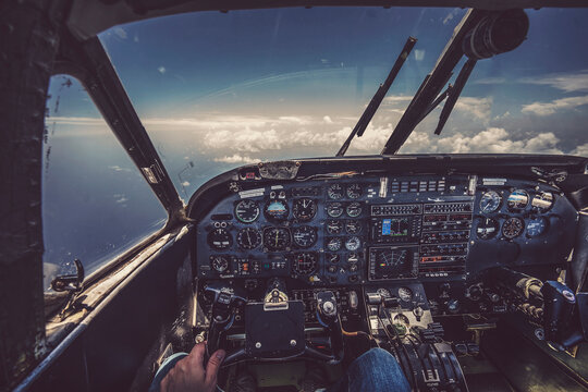 Low section of pilot flying airplane