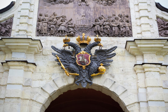 Coat of arms of the Russian empire double-headed eagle over the gates Museum Peter and Paul Fortress - Russia, Saint Petersburg, August 2020
