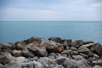 Fototapeta na wymiar More stones by the sea
