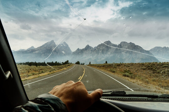 Cropped hand of man driving truck