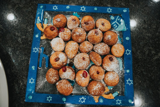 High angle view of Hanukkah Sufganiyot sweet desserts on table