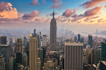 New York city empire state building landscape panorama at sunset with foggy clouds