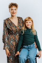 portrait of single mother and her daughter against white background