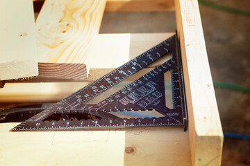 High angle view of speed square on workbench at construction site