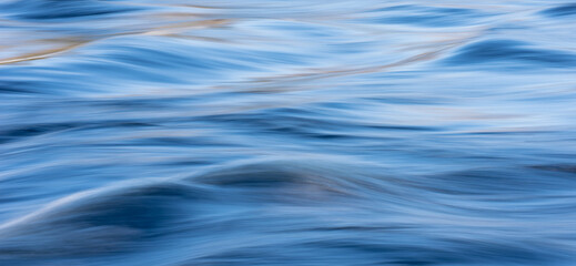 Blue water surface as a background texture.