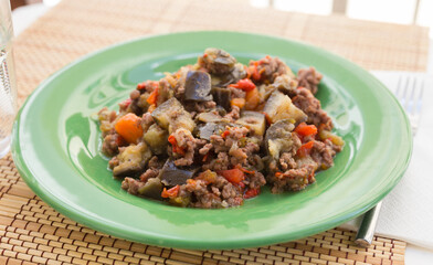 dish of vegetable stew. stewed eggplant, minced meat, carrots, peppers, onion squid