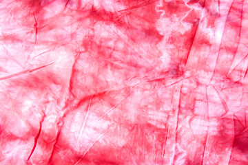 abstract pattern background of colorful traditional shibori tie dyed fabric with crumple creases and wrinkles 