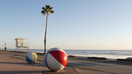 Pacific ocean beach, Oceanside California USA. Ball, lifeguard tower, life guard watchtower hut and...