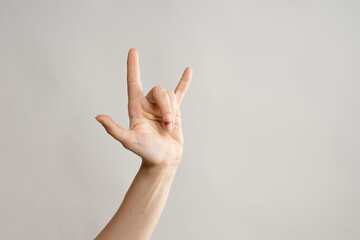 Hand gestures, Thumbs up, that's a cool gesture of the rocker. women's hand