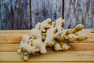 Fresh ginger root on the wooden table