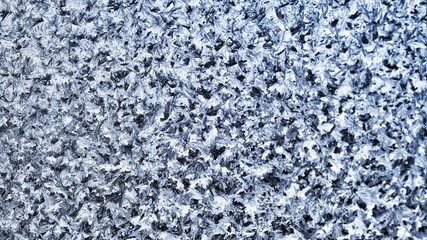 Fototapeta na wymiar texture of the ice patterns on the window.