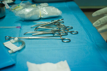 Surgical equipment and medical devices in operating room. Sterile scissors and other medical...