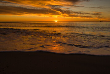 A beautiful sunrise from the shore of the beach