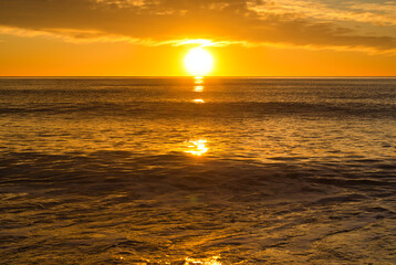 A beautiful sunrise from the shore of the beach