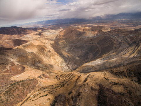 High angle view of Bingham Canyon against cloudy sky