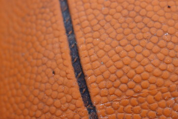 beautiful old and worn basketball lying in the snow