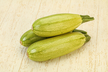 Young tasty zucchini over board