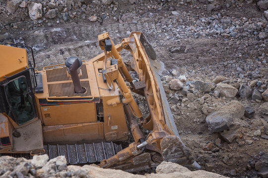 Mining machinery working over rocks