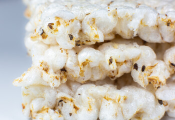 Healthy crispbread on white background. Vegetarian and diet food. Close up photo.