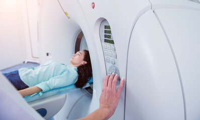 Doctor and patient in the room of computed tomography at hospital