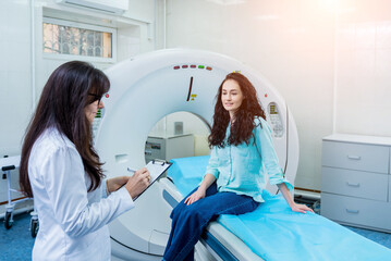 Doctor and patient in the room of computed tomography at hospital