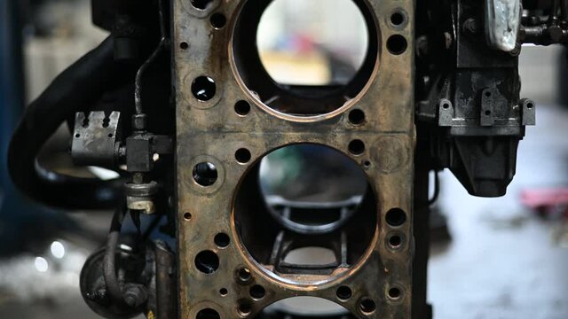 Video of motor spare parts with crankshaft on engine in workshop